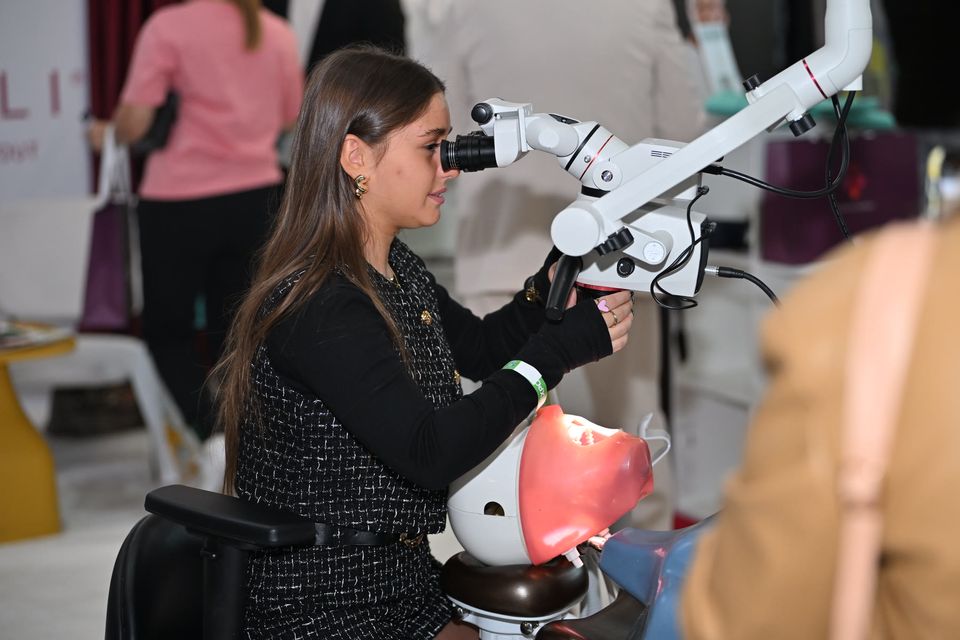 Hands-on practice on a training head under a dental microscope