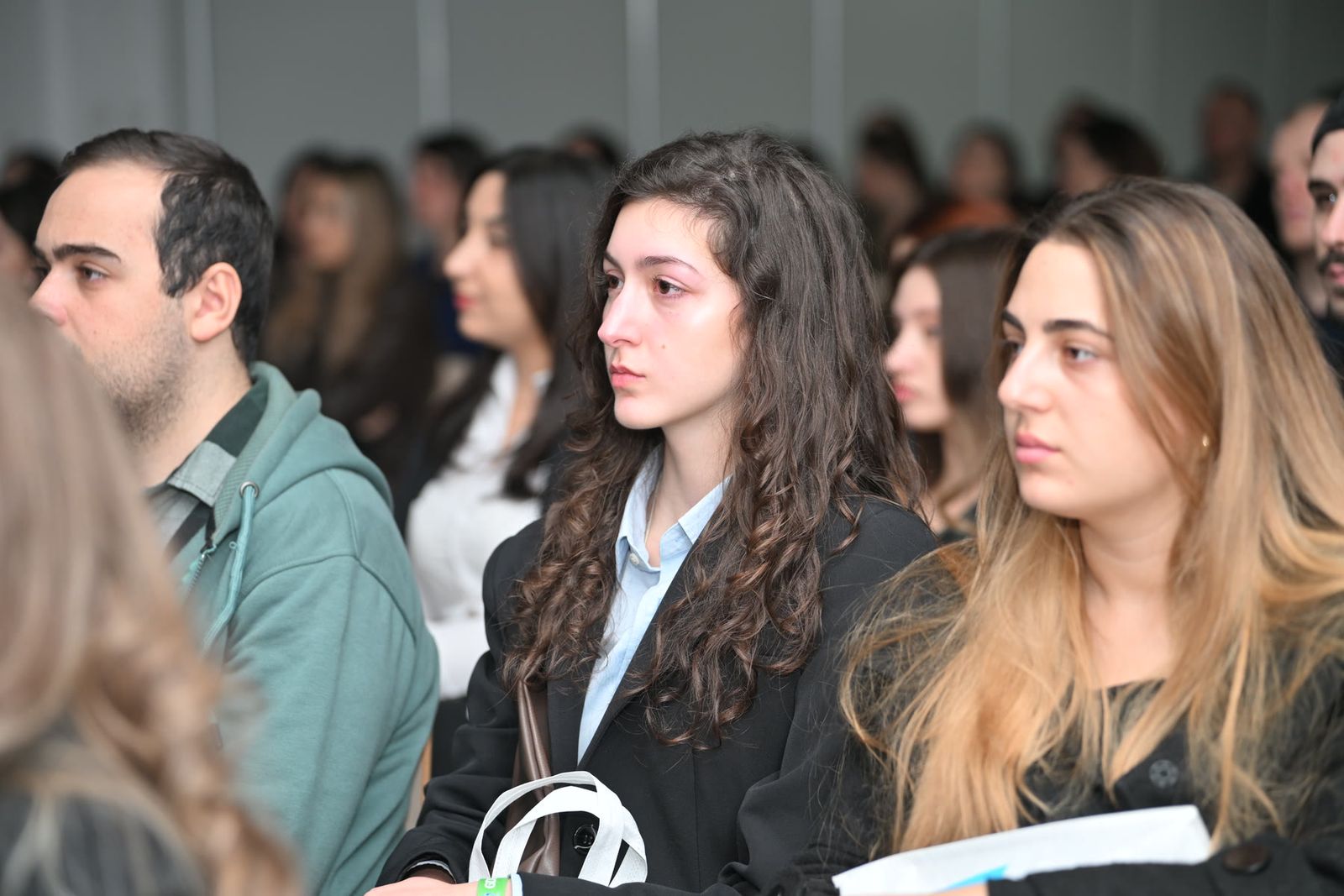 Attendees in the audience at a lecture